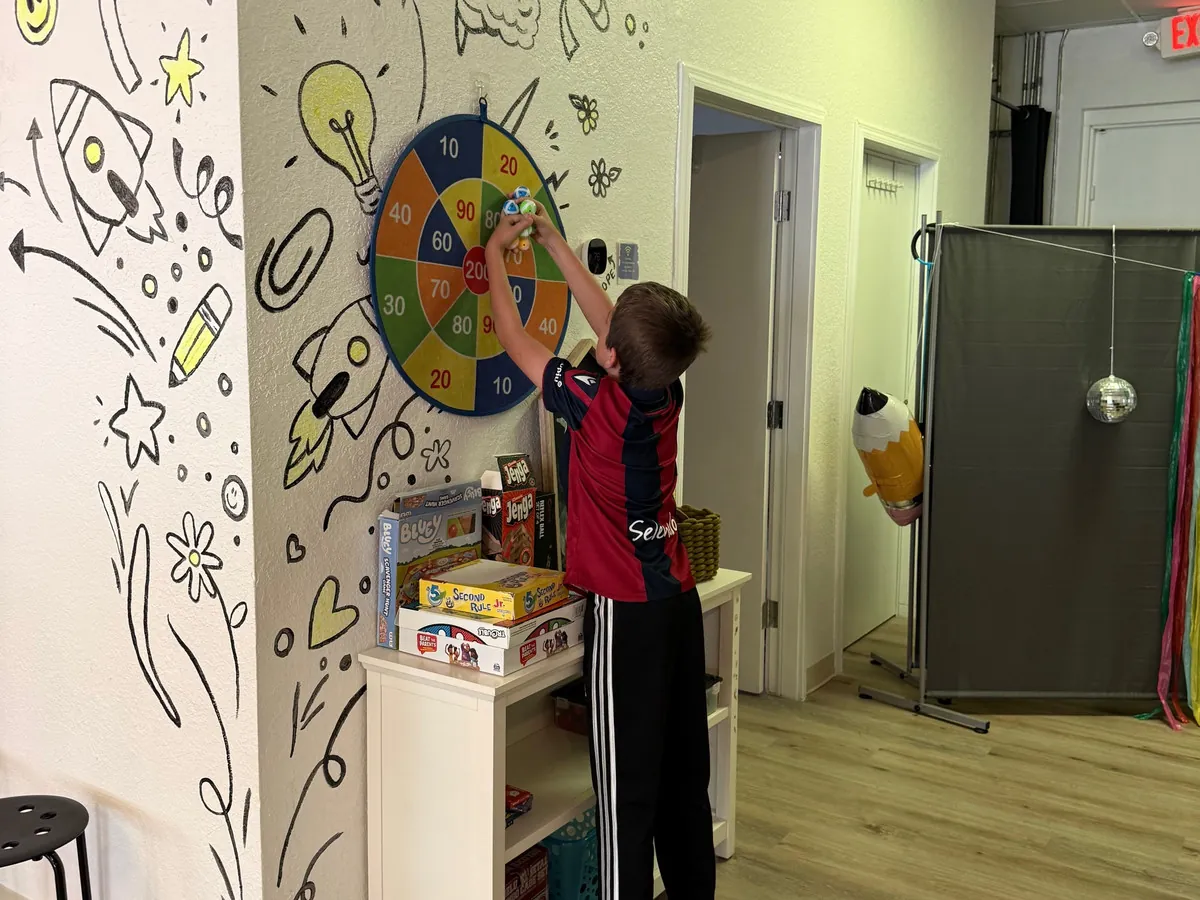 Child at summer camp doing hands-on activities